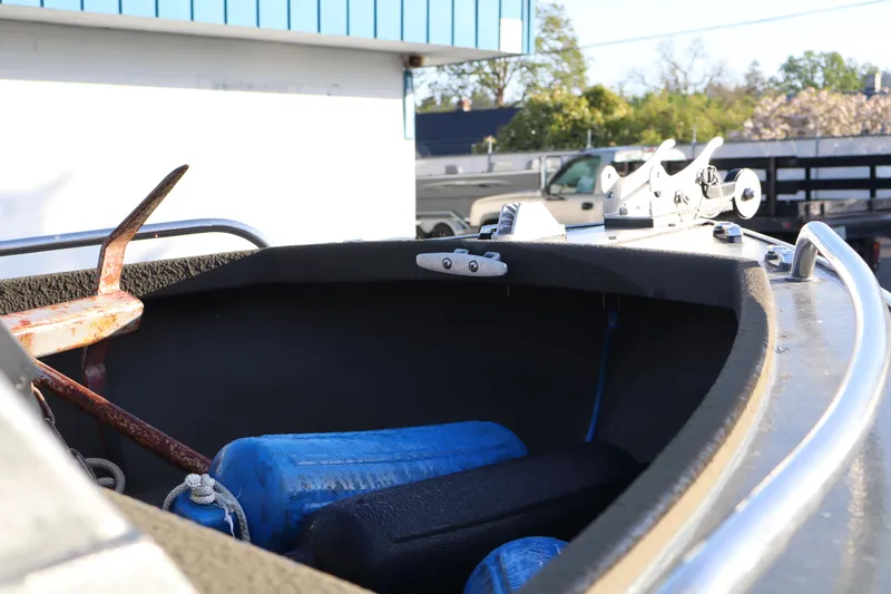 Slide: The Image of 1992 Alumaweld FV boat interior with anchor and blue fenders. - 12