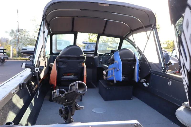 Slide: The Image of Interior of a 1992 Alumaweld FV boat with seating and fishing rod holder. - 7