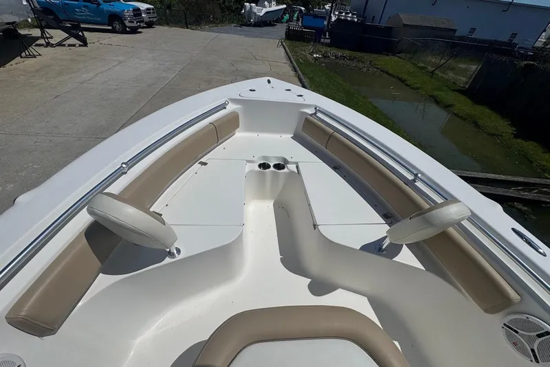 Slide: The Image of 2015 Key West 219 FS boat interior with beige seating and white deck. - 14