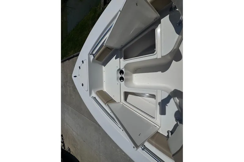 Slide: The Image of 2015 Key West 219 FS boat interior with seating and storage compartments. - 15