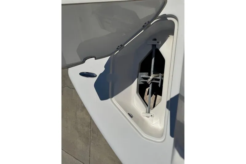 Slide: The Image of Open anchor compartment on a 2015 Key West 219 FS boat. - 16