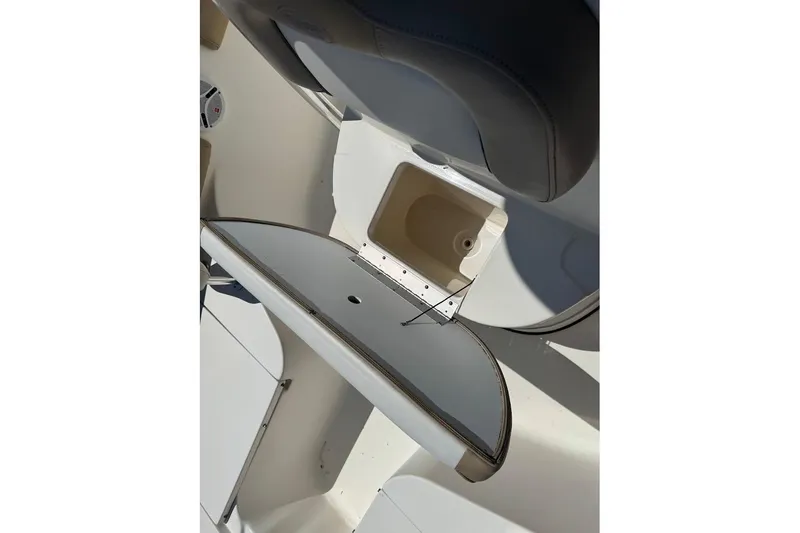 Slide: The Image of 2015 Key West 219 FS boat interior storage compartment open. - 17