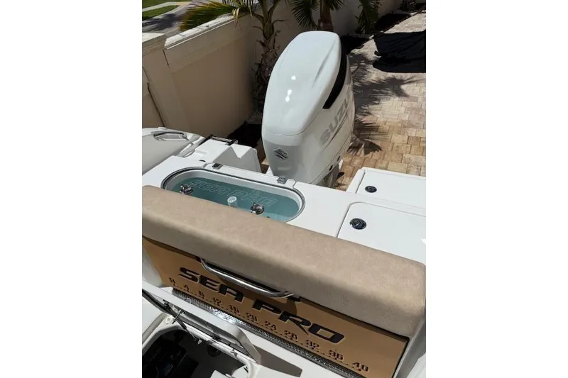 Slide: The Image of 2025 Sea Pro 240 Dual Console boat on trailer at night, residential street. - 13