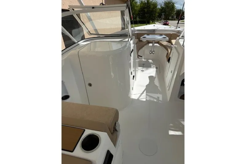 Slide: The Image of Suzuki Four Stroke engine on a 2025 Sea Pro 240 Dual Console boat. - 14