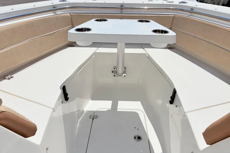 Slide: The Image of 2025 Sea Pro 240 Dual Console boat interior with table and seating. - 22