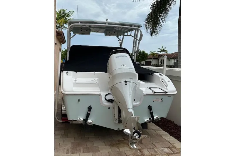 Slide: The Image of 2025 Sea Pro 240 Dual Console boat on trailer under blue sky. - 3