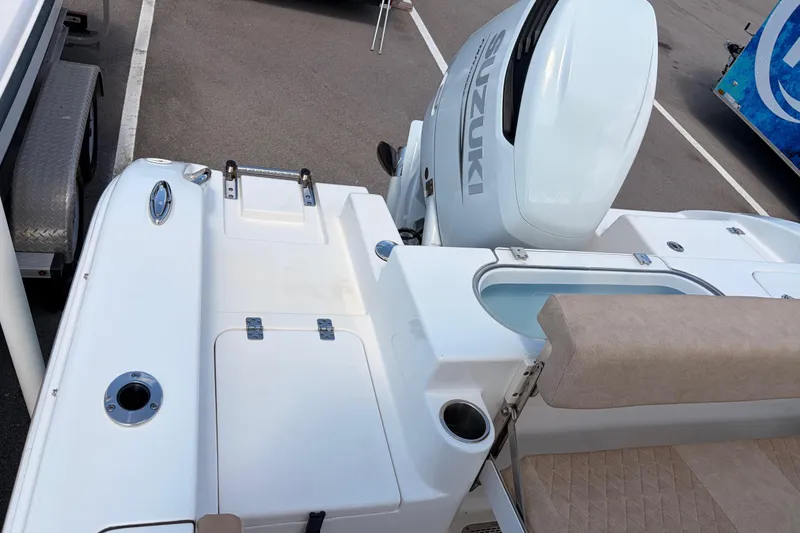 Slide: The Image of 2025 Sea Pro 240 Dual Console boat with Suzuki outboard motor, featuring spacious deck layout. - 38