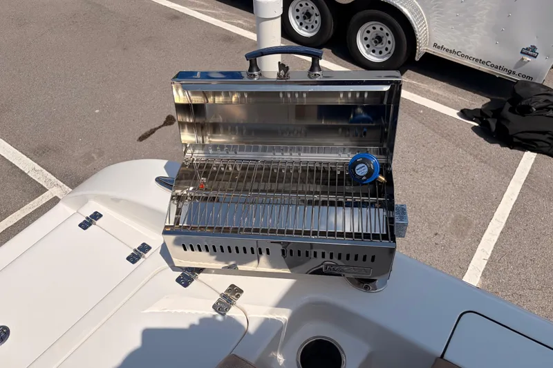 Slide: The Image of Stainless steel grill on 2025 Sea Pro 240 Dual Console boat deck. - 40