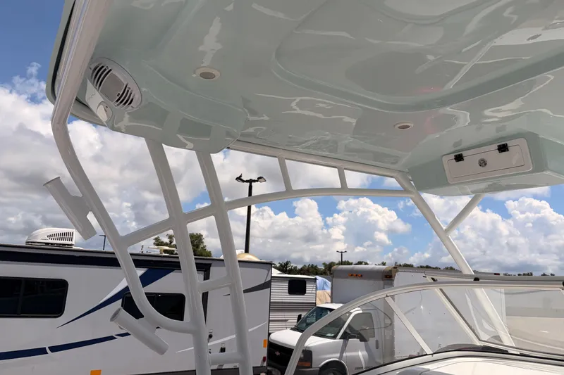 Slide: The Image of 2025 Sea Pro 240 Dual Console boat with sleek overhead design and speakers. - 43