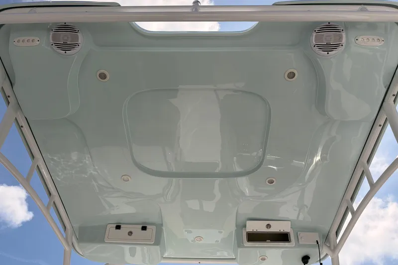 Slide: The Image of 2025 Sea Pro 240 Dual Console boat ceiling with speakers and lighting fixtures. - 44