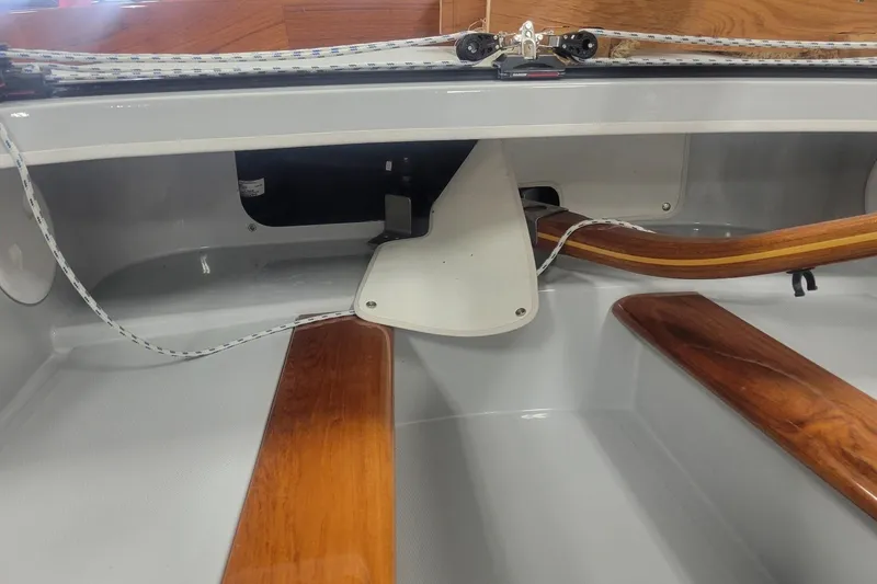 Slide: The Image of Interior view of a 2018 C.W. Hood 32 Daysailer, showcasing wooden trim and rigging details. - 16