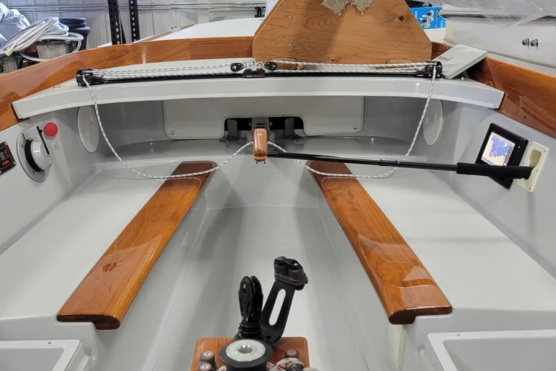 Slide: The Image of Interior of a 2018 C.W. Hood 32 Daysailer, featuring wooden benches and modern controls. - 6