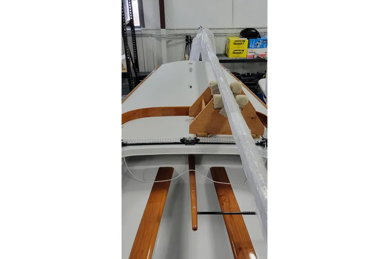 Slide: The Image of 2018 C.W. Hood 32 Daysailer with wooden accents in a storage facility. - 8