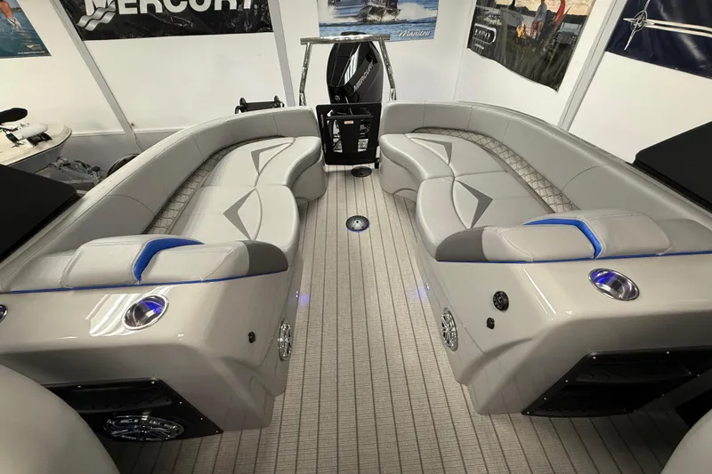 Slide: The Image of Luxurious interior of 2026 Manitou 25 LX RFW pontoon boat with plush seating. - 13