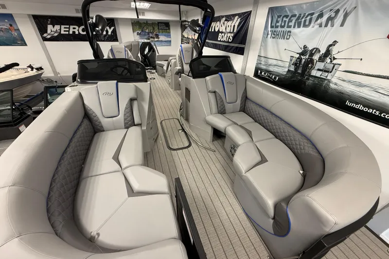 Slide: The Image of Interior of 2026 Manitou 25 LX RFW pontoon boat with luxurious seating. - 7