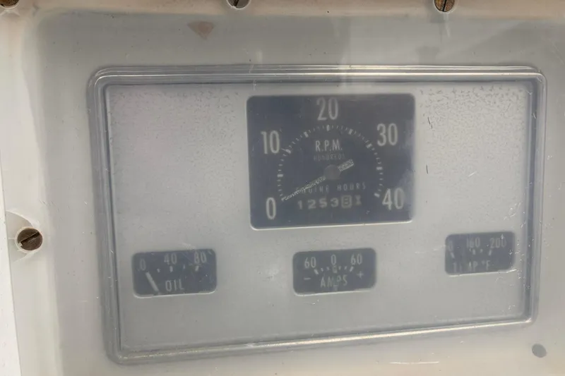 Slide: The Image of Hinckley Bermuda 40 MKIII 1980 engine panel displaying RPM, oil, amps, and temperature gauges. - 16