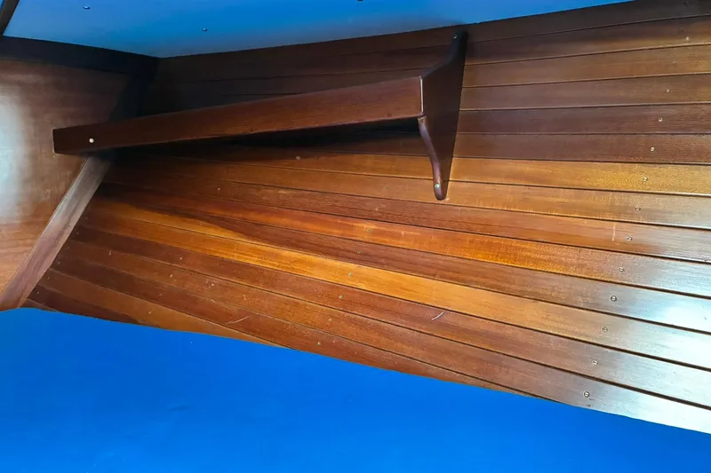 Slide: The Image of Interior of 1980 Hinckley Bermuda 40 MKIII with wooden paneling and shelf. - 28