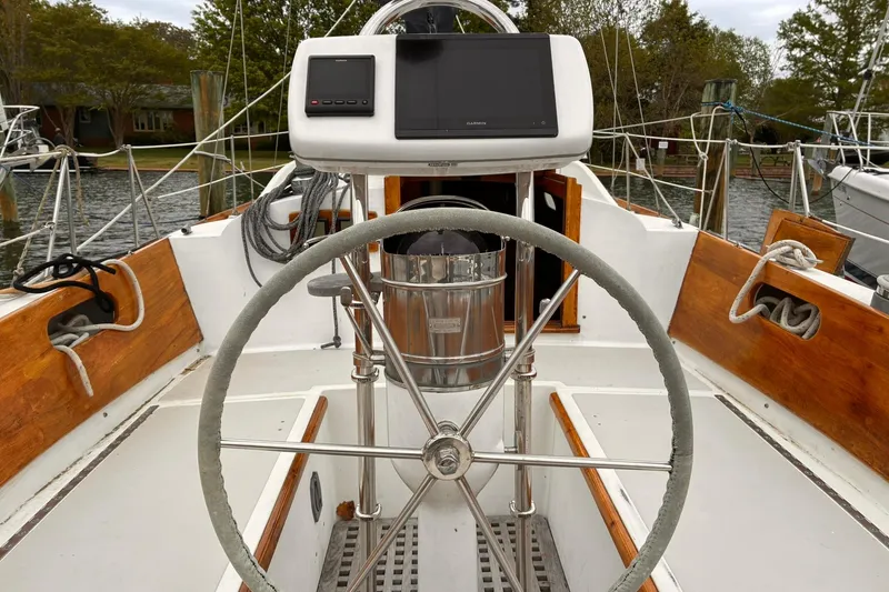 Slide: The Image of Cockpit of 1980 Hinckley Bermuda 40 MKIII sailboat with steering wheel and navigation equipment. - 3
