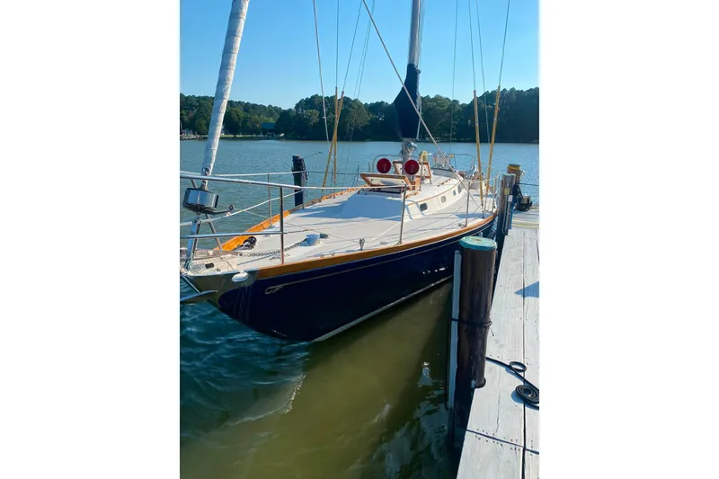 Slide: The Image of 1980 Hinckley Bermuda 40 MKIII sailboat docked on a sunny day. - 35