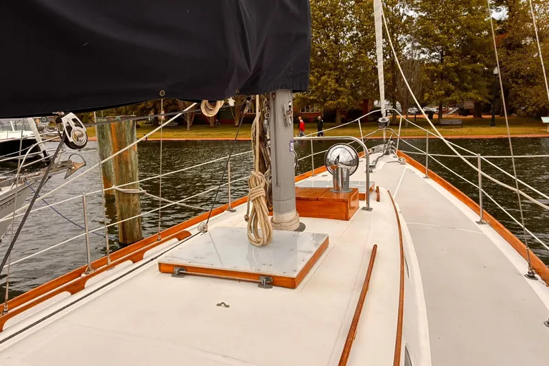 Slide: The Image of Sailboat deck view of 1980 Hinckley Bermuda 40 MKIII, docked by the water. - 7