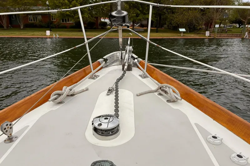 Slide: The Image of Bow view of 1980 Hinckley Bermuda 40 MKIII sailboat with anchor chain and ropes. - 9