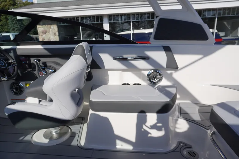 Slide: The Image of 2026 Chaparral 247 SSX boat interior with sleek seating and modern dashboard design. - 13