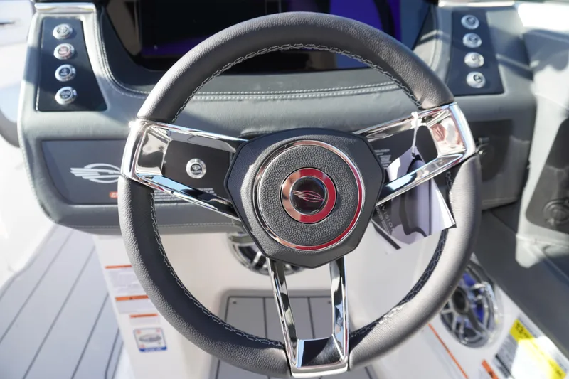 Slide: The Image of Steering wheel of 2026 Chaparral 247 SSX boat, featuring sleek design and modern controls. - 15