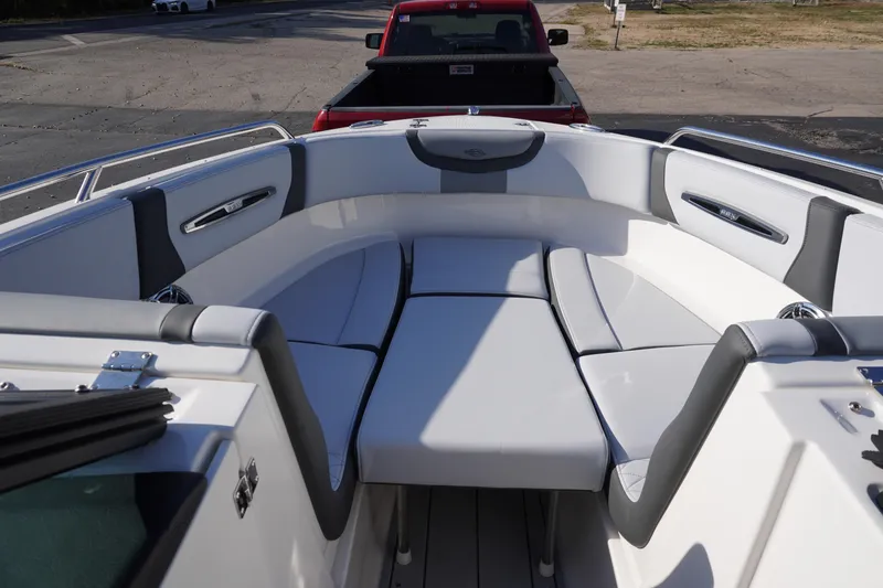 Slide: The Image of 2026 Chaparral 247 SSX boat interior with white and gray seating. - 19