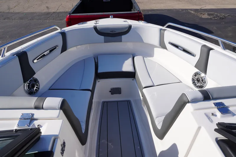Slide: The Image of 2026 Chaparral 247 SSX boat interior with white and gray seating, speakers, and sleek design. - 21