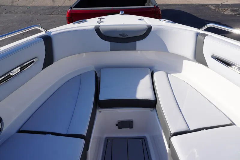 Slide: The Image of 2026 Chaparral 247 SSX boat interior with sleek white and gray seating. - 22