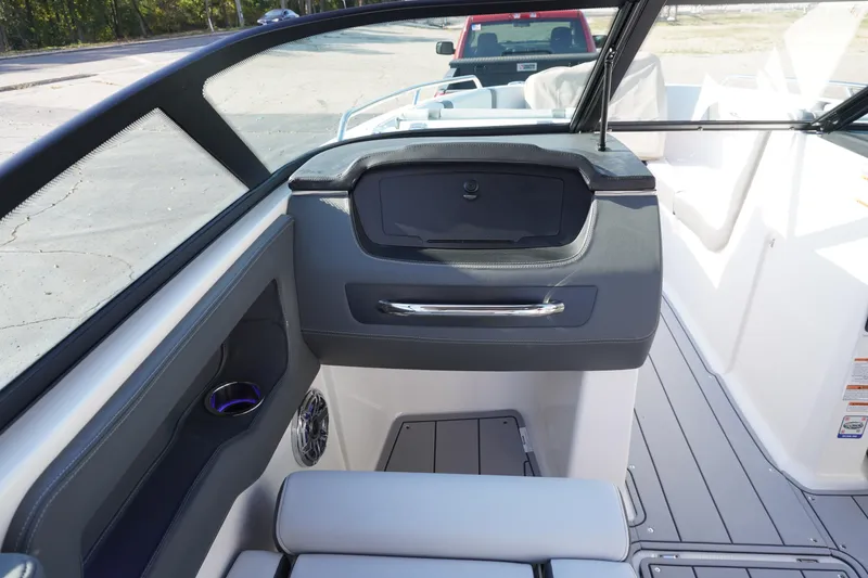 Slide: The Image of 2026 Chaparral 247 SSX boat interior with sleek dashboard and seating. - 24