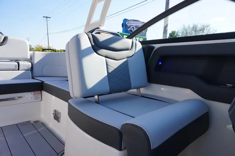 Slide: The Image of 2026 Chaparral 247 SSX boat interior with modern seating and sleek design. - 28