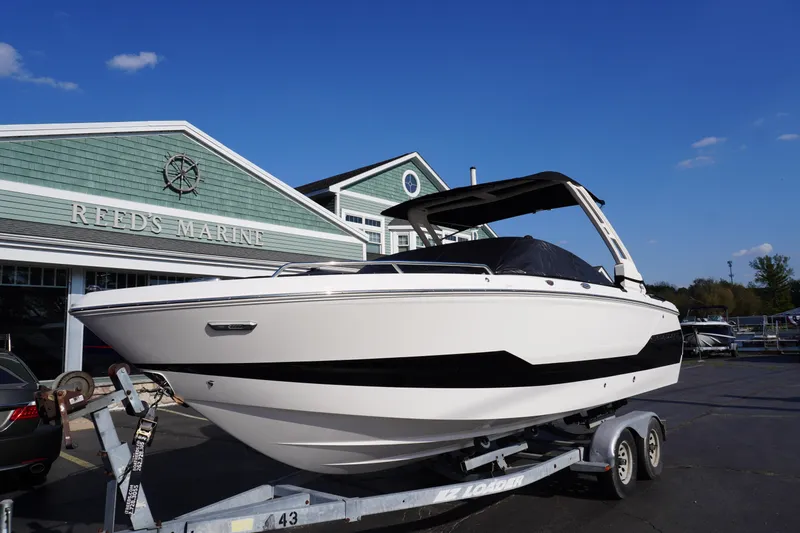 Slide: The Image of 2026 Chaparral 247 SSX boat on trailer at Reed's Marine dealership. - 36