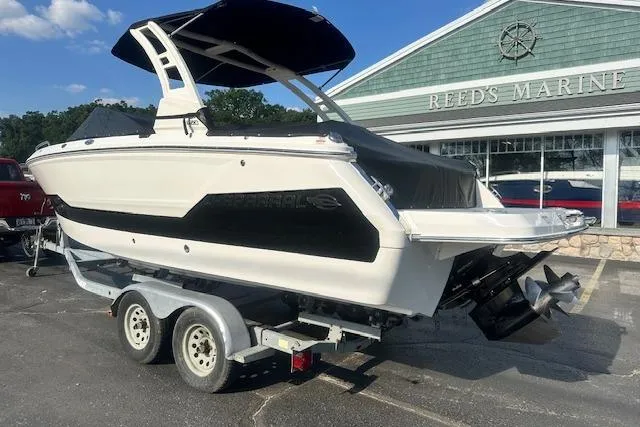 Slide: The Image of 2026 Chaparral 247 SSX boat on trailer at Reed's Marine dealership. - 37