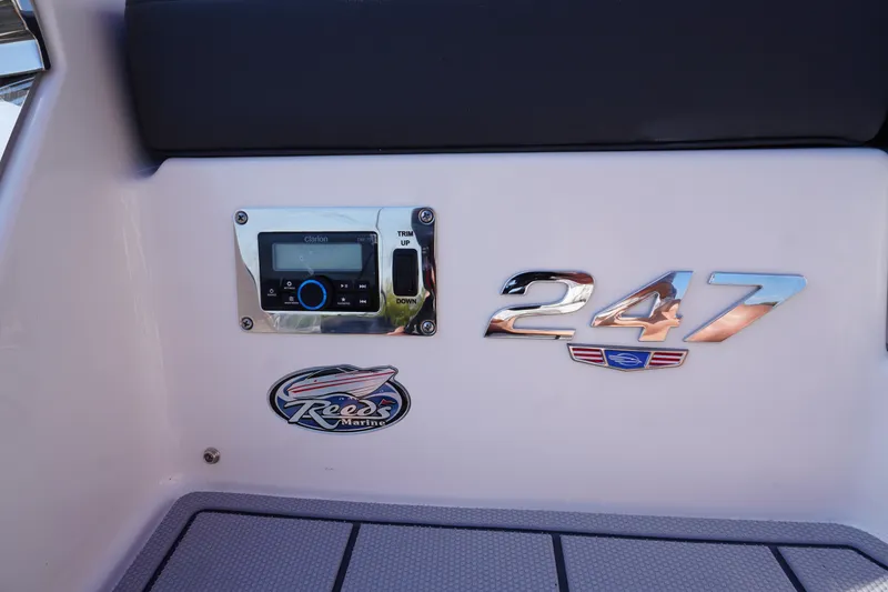 Slide: The Image of 2026 Chaparral 247 SSX boat dashboard with Clarion stereo and Reeds Marine logo. - 7