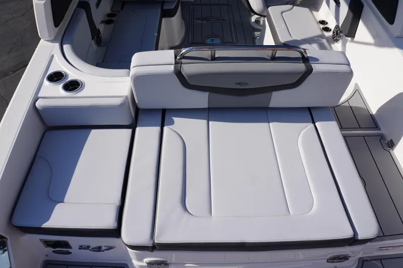 Slide: The Image of 2026 Chaparral 247 SSX boat interior with sleek seating and cup holders. - 9