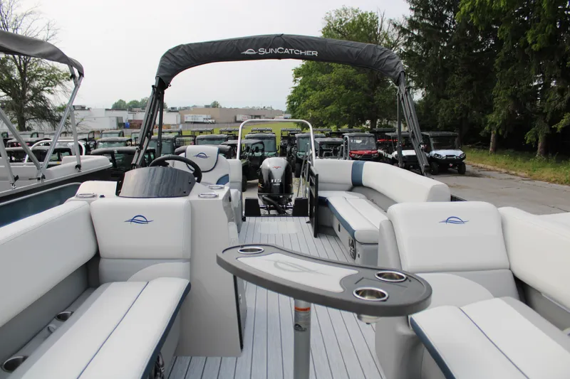 Slide: The Image of 2025 SunCatcher Select 320RCX pontoon boat with spacious seating and modern design. - 15