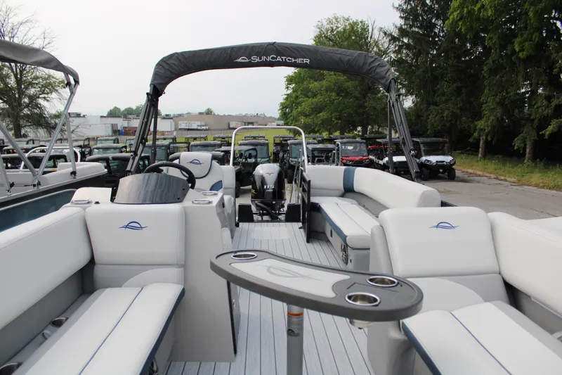 Slide: The Image of 2025 SunCatcher Select 320RCX pontoon boat with spacious seating and modern design. - 16