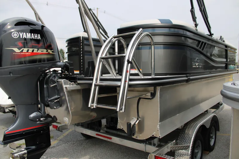 Slide: The Image of 2025 SunCatcher Select 320RCX pontoon boat with Yamaha VMAX engine and ladder. - 4