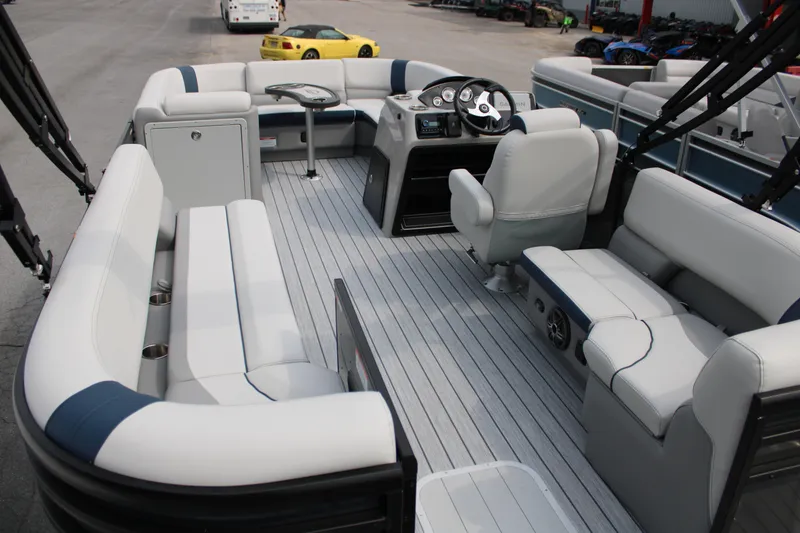 Slide: The Image of Interior of 2025 SunCatcher Select 320RCX pontoon boat with luxurious seating and modern dashboard. - 7