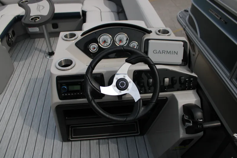 Slide: The Image of Cockpit of 2025 SunCatcher Select 320RCX boat with Garmin navigation system. - 8