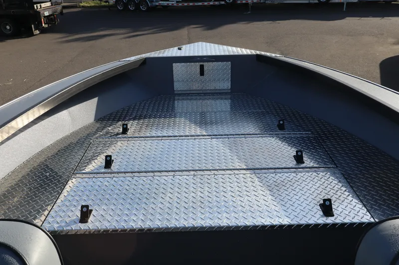 Slide: The Image of Alumaweld Columbia 23 boat deck, 2026 model, featuring diamond plate flooring. - 10
