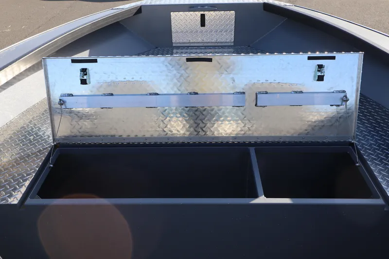 Slide: The Image of 2026 Alumaweld Columbia 23 boat storage compartment with diamond plate lid open. - 11
