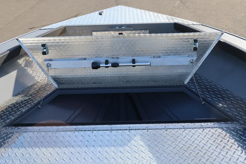 Slide: The Image of Open storage compartment on 2026 Alumaweld Columbia 23 boat with diamond plate finish. - 13