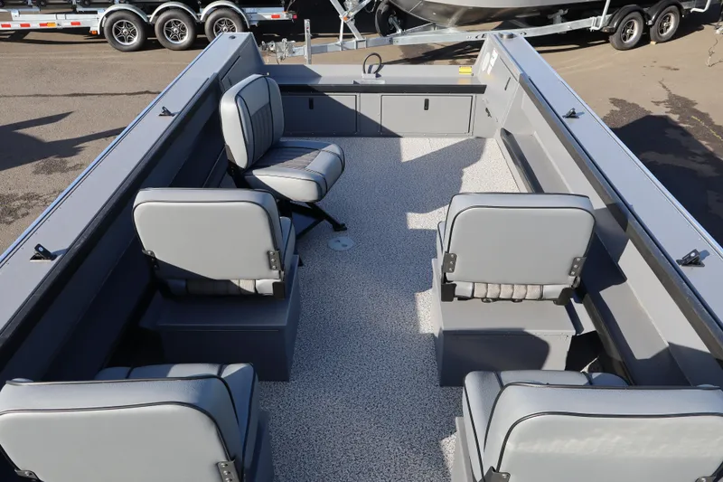 Slide: The Image of 2026 Alumaweld Columbia 23 boat interior with gray seating and spacious layout. - 16