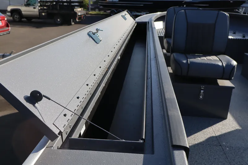 Slide: The Image of 2026 Alumaweld Columbia 23 boat interior with open storage compartment and seating. - 18