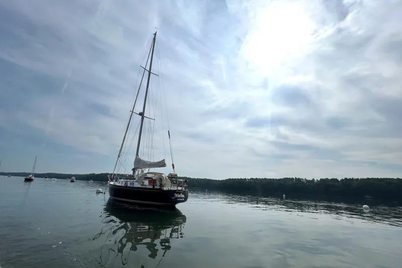Slide: The Image of 1982 Bristol 38.8 sailboat on calm waters. - 14