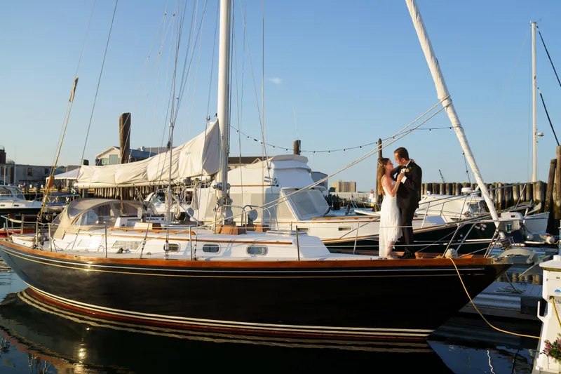Slide: The Image of Couple on a 1982 Bristol 38.8 yacht at sunset. - 17