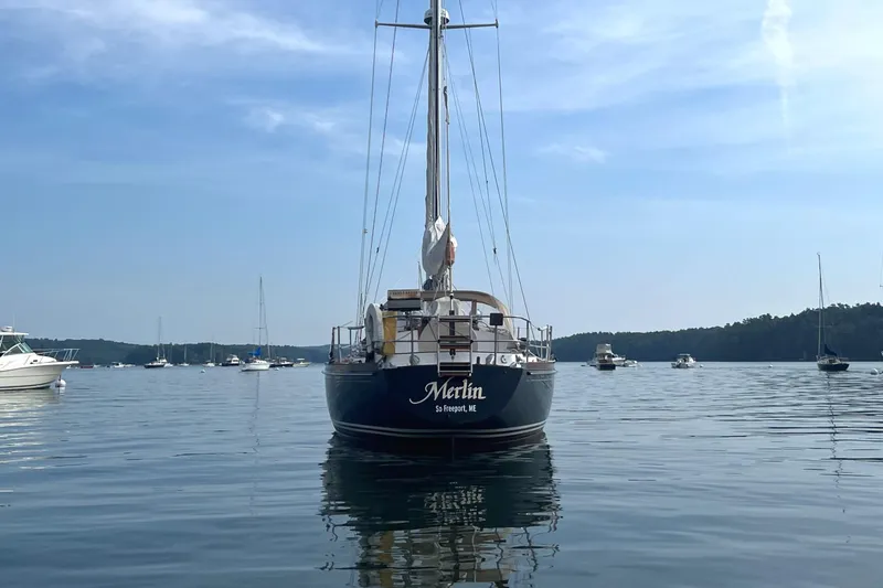 Slide: The Image of 1982 Bristol 38.8 sailboat on calm water, blue sky. - 19