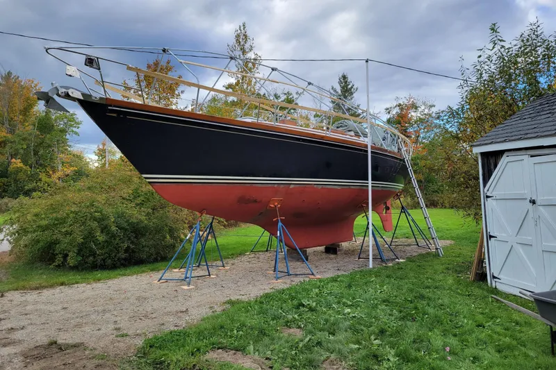 Slide: The Image of 1982 Bristol 38.8 sailboat propped up in a yard. - 47